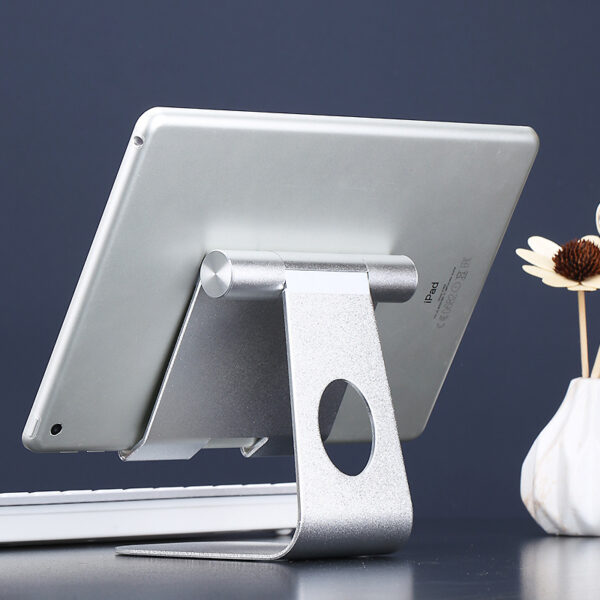 Adjustable tablet and phone stand holder, compatible with Apple devices, for desk use.